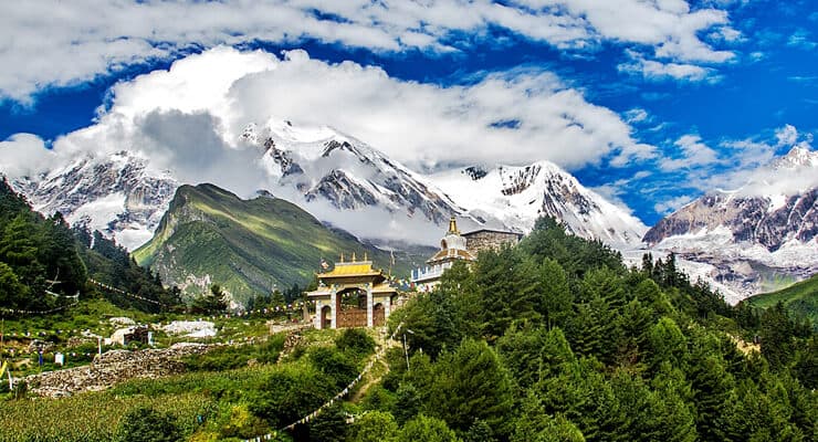 Turquoise glacial lake below snow peaks on the Manaslu circuit