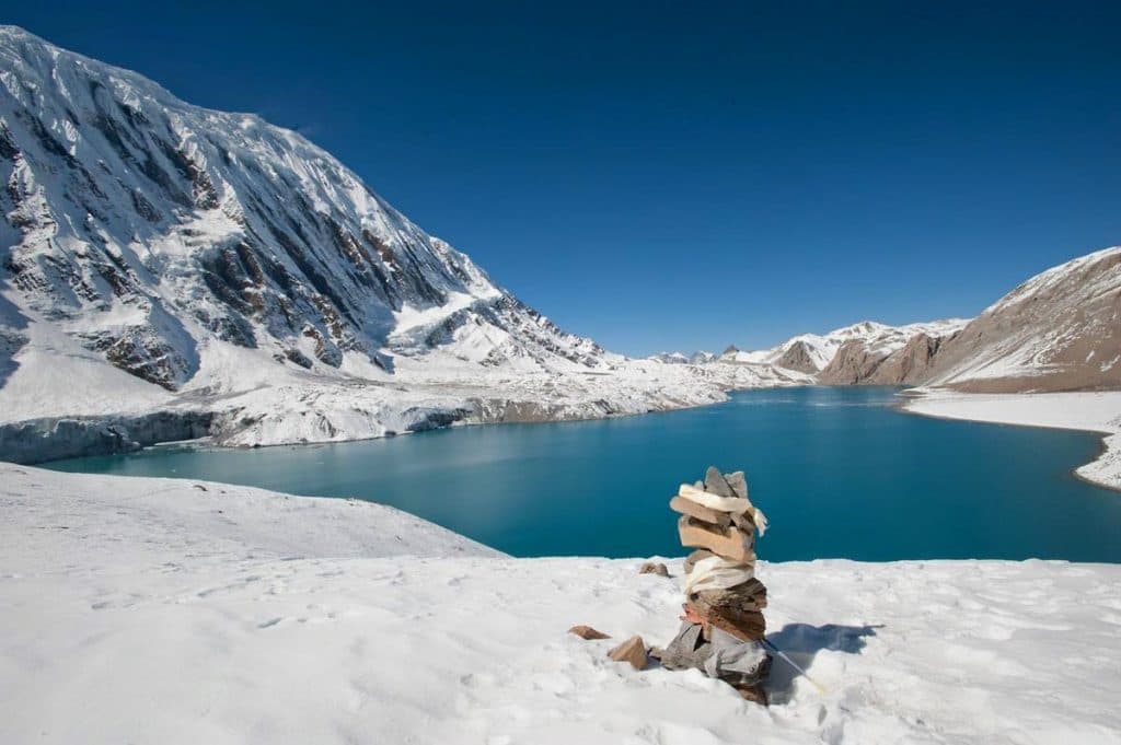 Prayer flags strung against a Himalayan peak